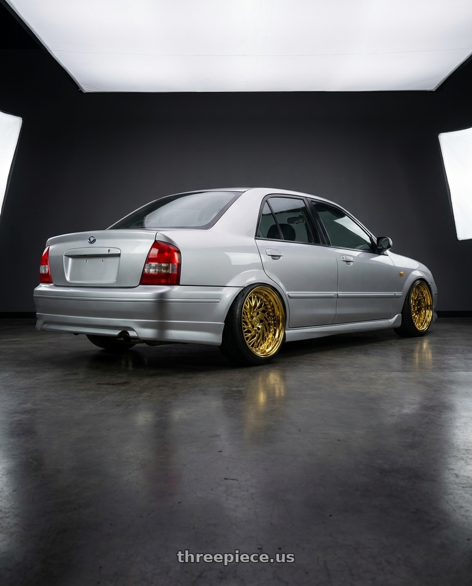 2004 ford tierra with Aodhan DS03 5x114.3 18x9.5 +30 Gold Vacuum w/ Chrome Rivets wheels rear three quarter view slight stretch tires