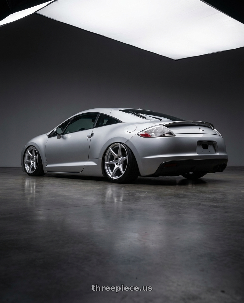 2010 Mitsubishi Eclipse with Kansei K11S Tandem 5x114.3 19x9.5 22 Hyper Silver wheels rear three quarter view slight stretch tires