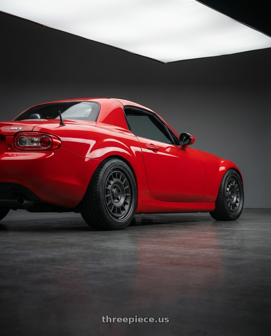 2012 Mazda MX-5 Miata NC with fifteen52 ALPEN MX 5x114.3 17x8 +38 FROSTED GRAPHITE (SATIN GREY) wheels rear three quarter view square tires