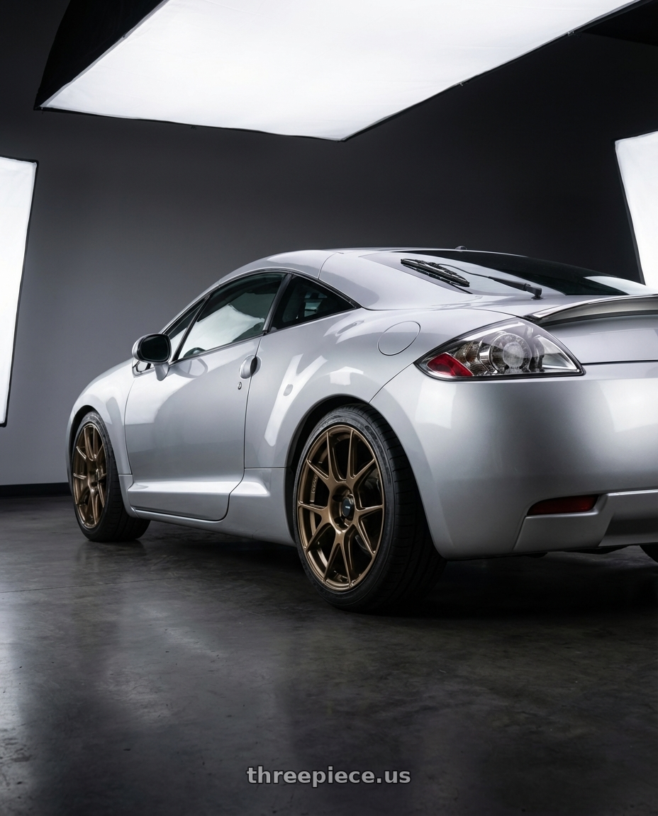 2010 Mitsubishi Eclipse with Konig Ampliform 5x114.3 18x8.5+35 Gloss Bronze wheels rear three quarter view square tires