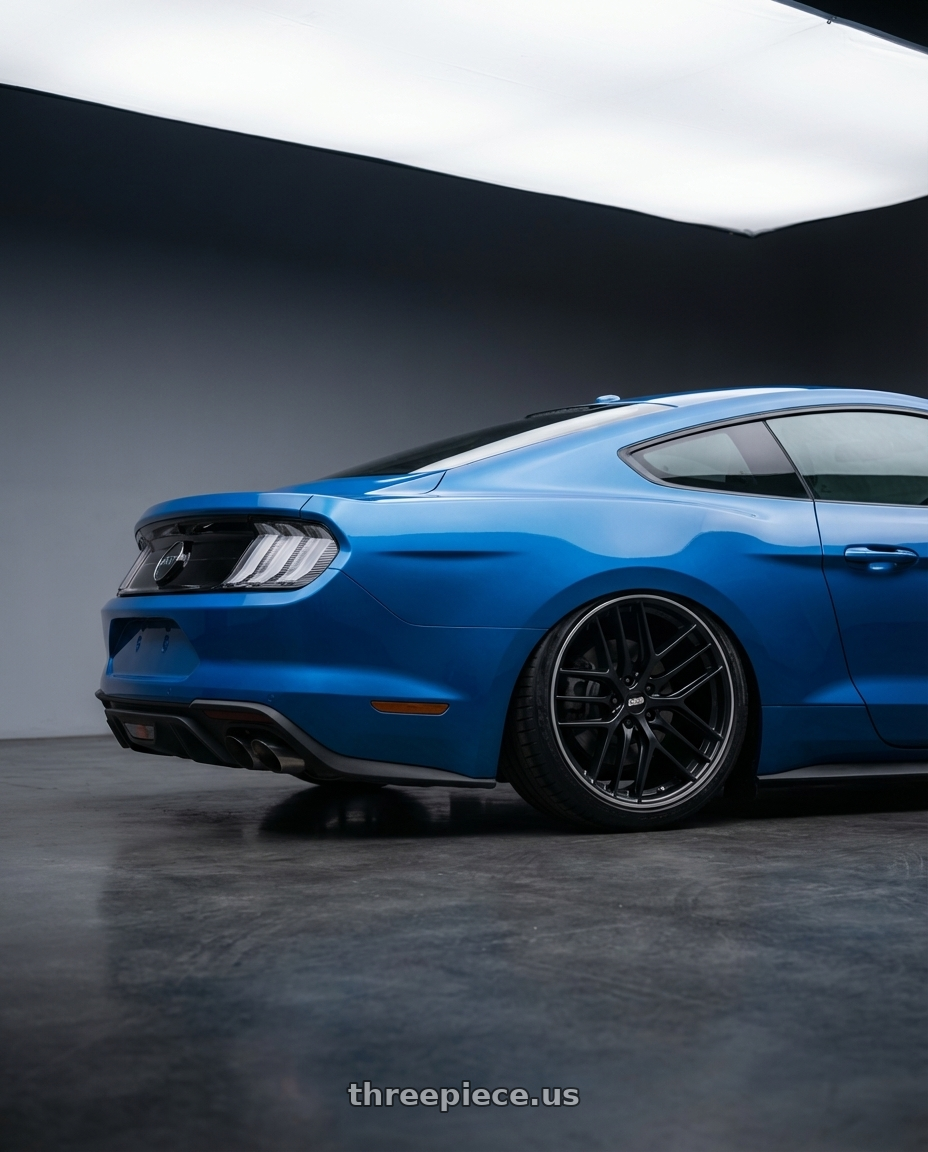 2022 Ford Mustang GT with BBS CC-R 5x114.3 20x9.5+35 Satin Black wheels rear three quarter view slight stretch tires