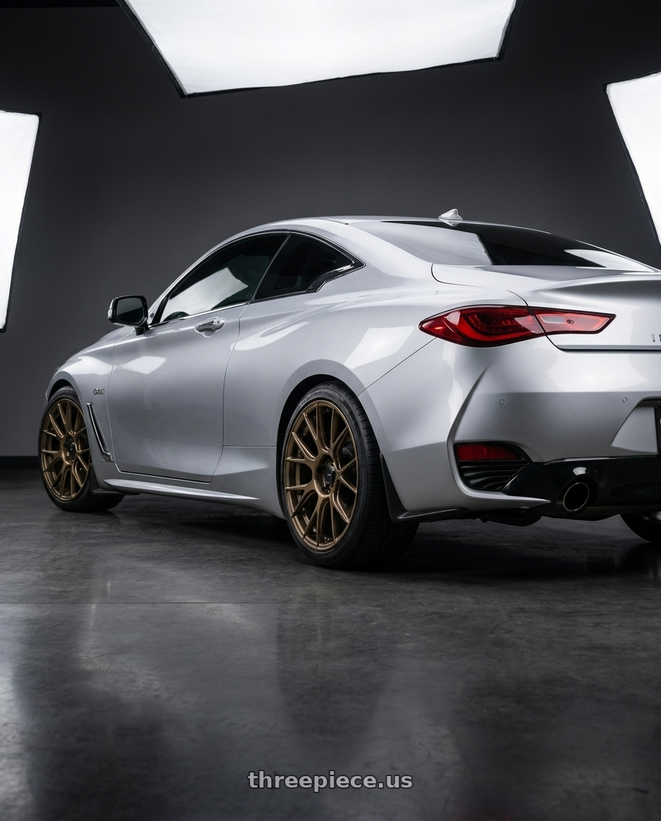 2020 Infiniti Q60 with Konig Ampliform 5x114.3 19x9.5+35 Gloss Bronze wheels rear three quarter view square tires