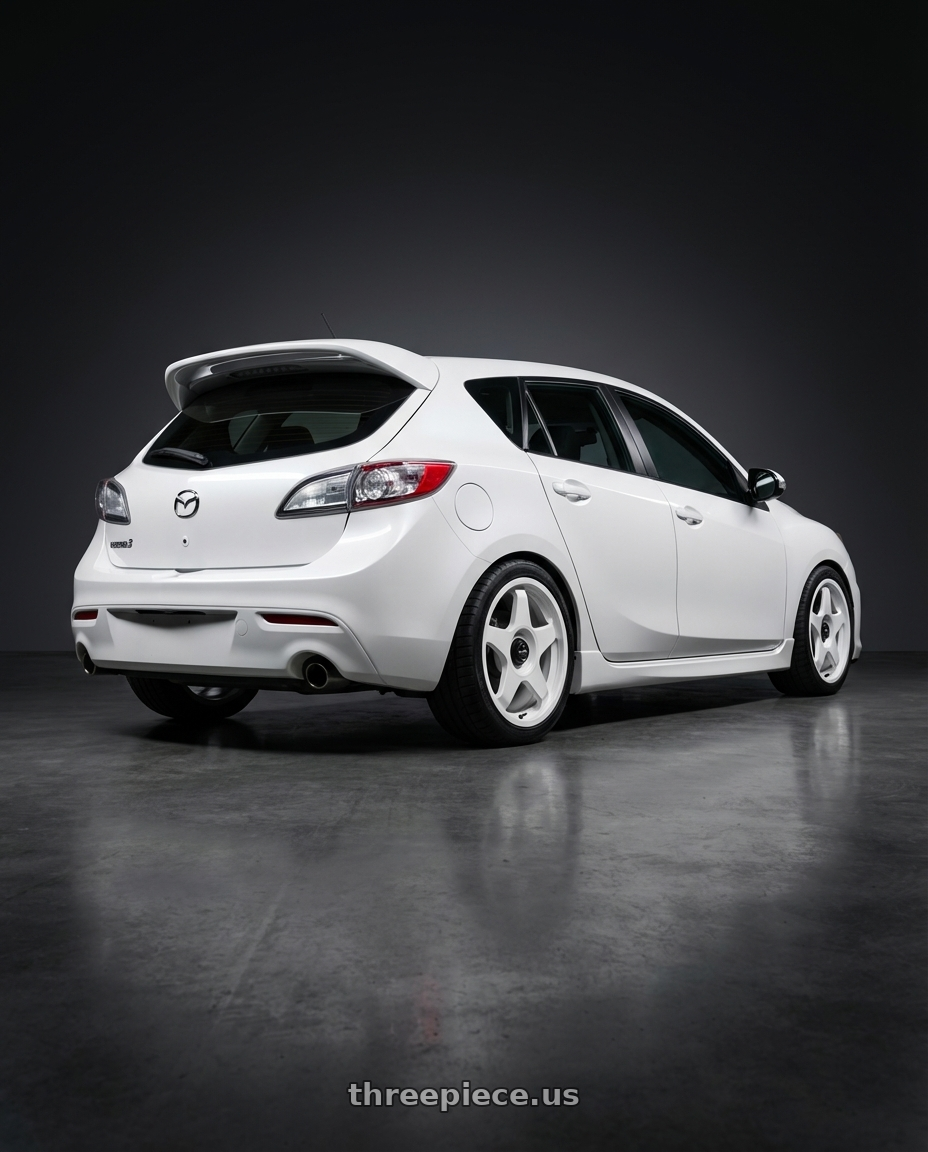 2012 Mazda Mazdaspeed3 with fifteen52 CHICANE 5x114.3 / 5x100 18x8.5 +35 RALLY WHITE (GLOSS WHITE) wheels rear three quarter view square tires