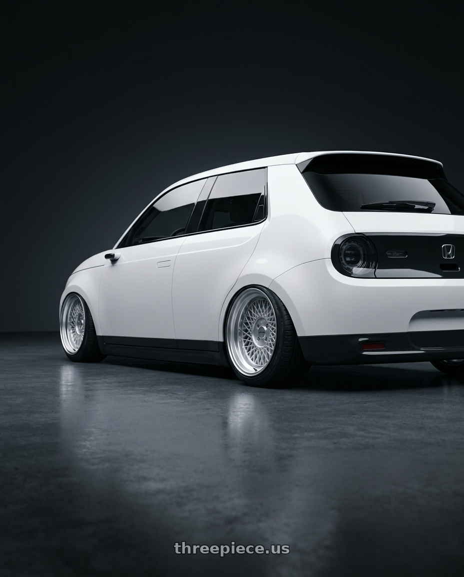 2022 Honda e with Klutch SL1 4x100 15x8.5  +20 Silver Machined Lip wheels rear three quarter view slight stretch tires