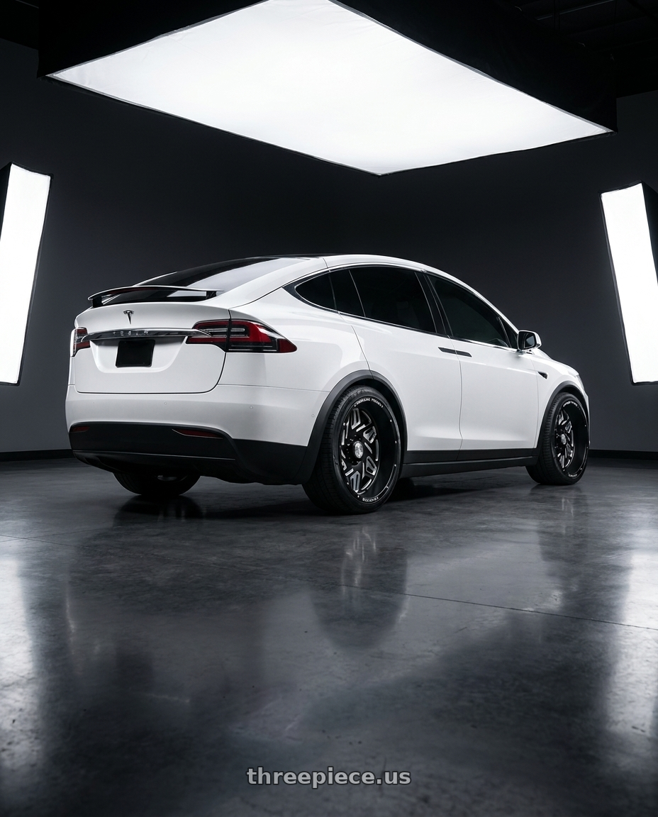 2024 model x with American Truxx Forged Orion ATF1908 6x139.7 24x14-76 Matte Black/Milled wheels rear three quarter view square tires