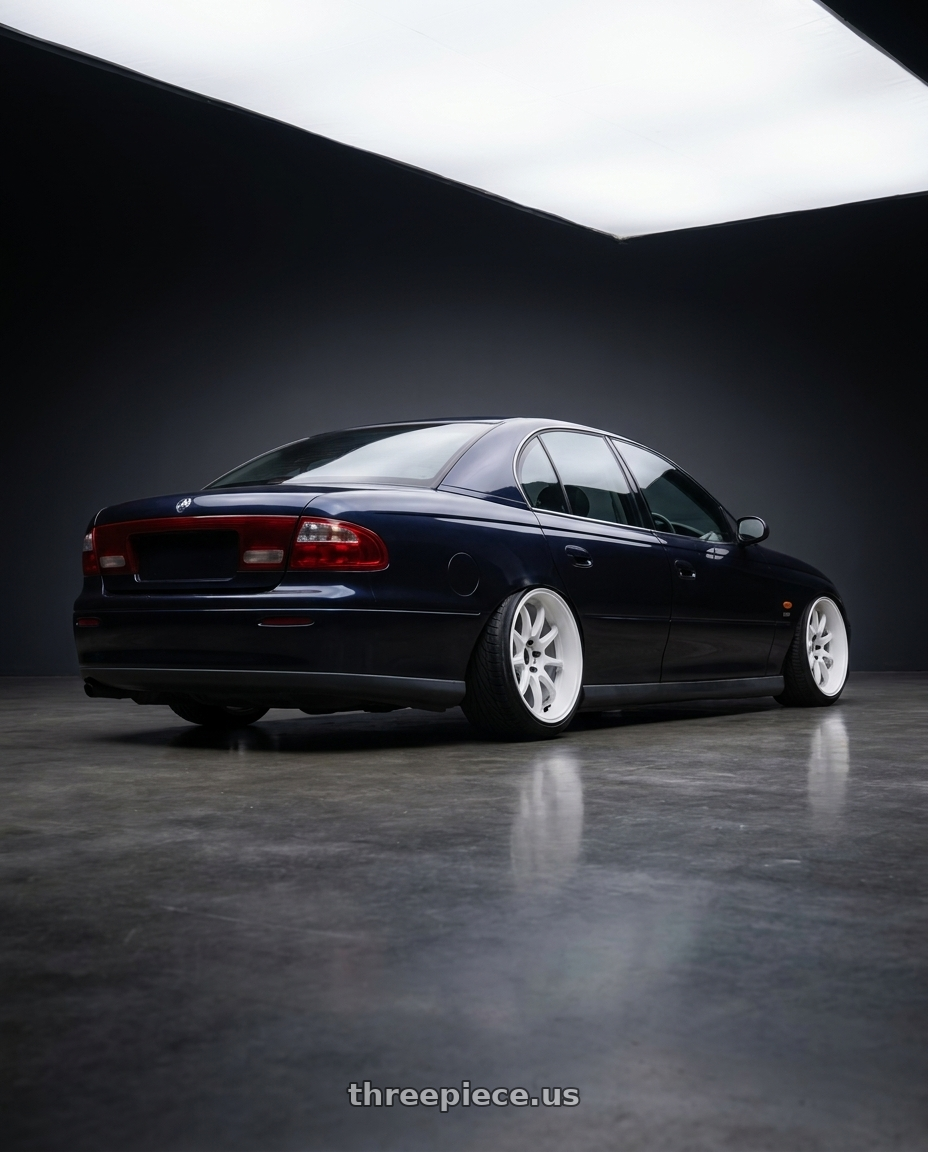 1997 holden vt commodore raven with Work Emotion D9r 5x120 19x10.5 +23 White wheels rear three quarter view extreme stretch tires