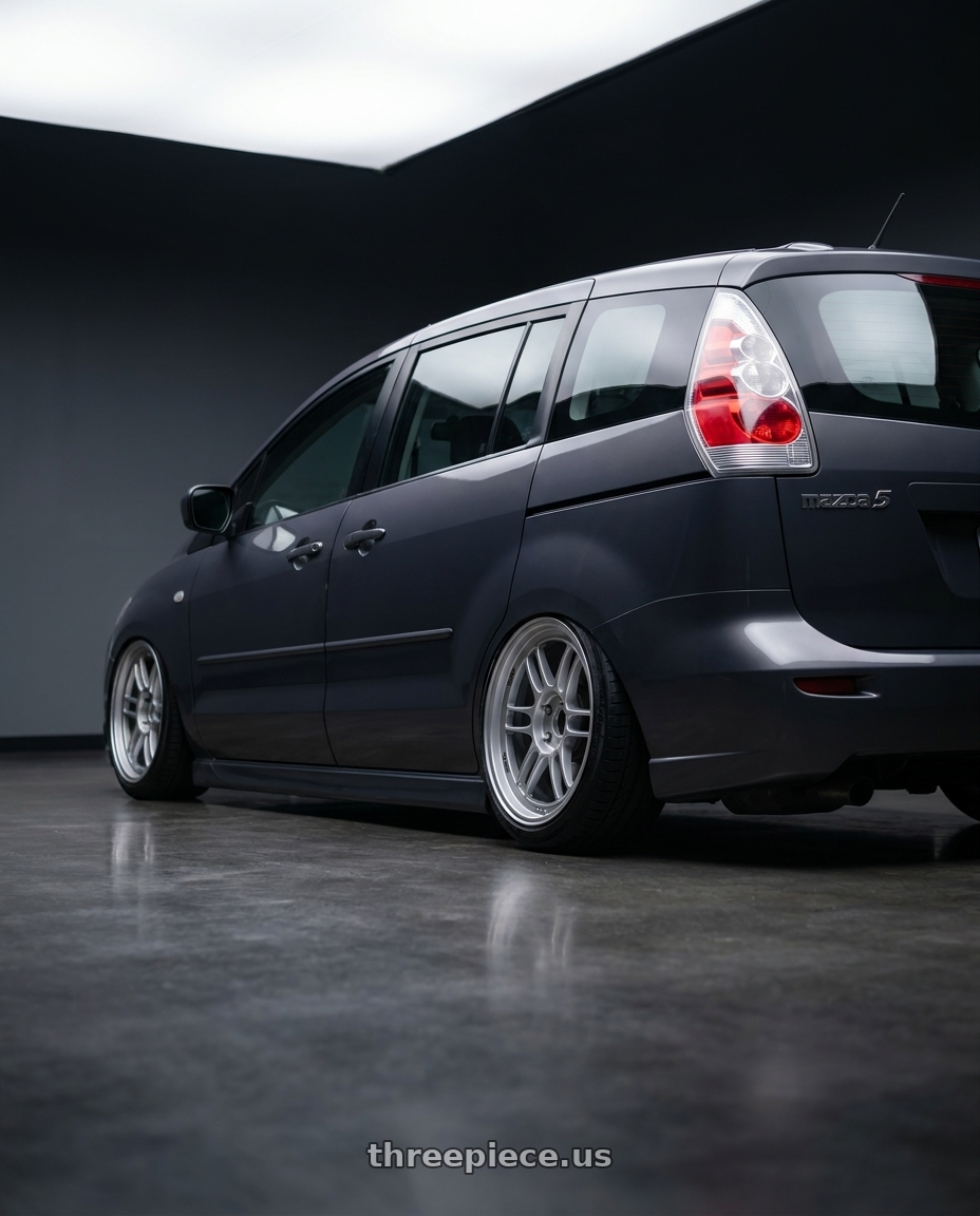 2007 Mazda 5 with Enkei RPF1 5x100 16x7+35 Silver wheels rear three quarter view slight stretch tires