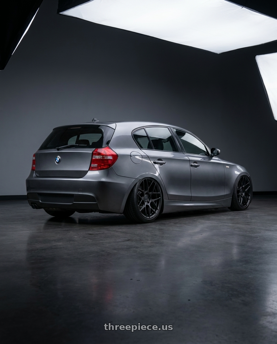 2012 BMW 1 Series E82 with Aodhan AFF2 5x120 19x9.5+35 Matte Black wheels rear three quarter view slight stretch tires