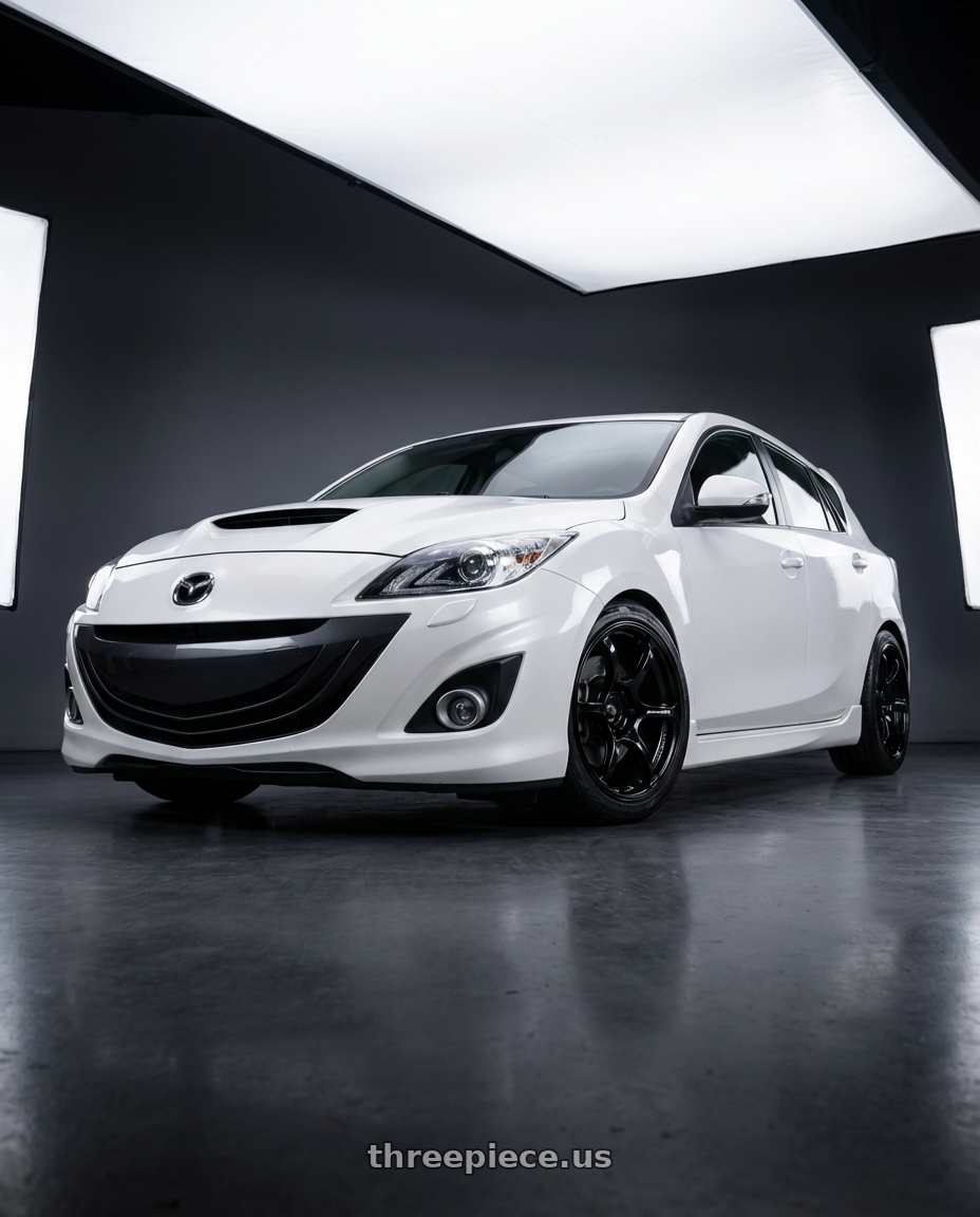 2012 Mazda Mazdaspeed3 with Advan RGIII 5x114.3 18x9.0+35 Gloss Black wheels front three quarter view lowered stance