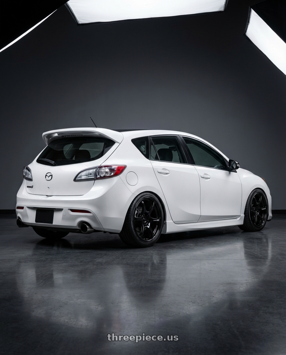 2012 Mazda Mazdaspeed3 with Advan RGIII 5x114.3 18x9.0+35 Gloss Black wheels rear three quarter view square tires