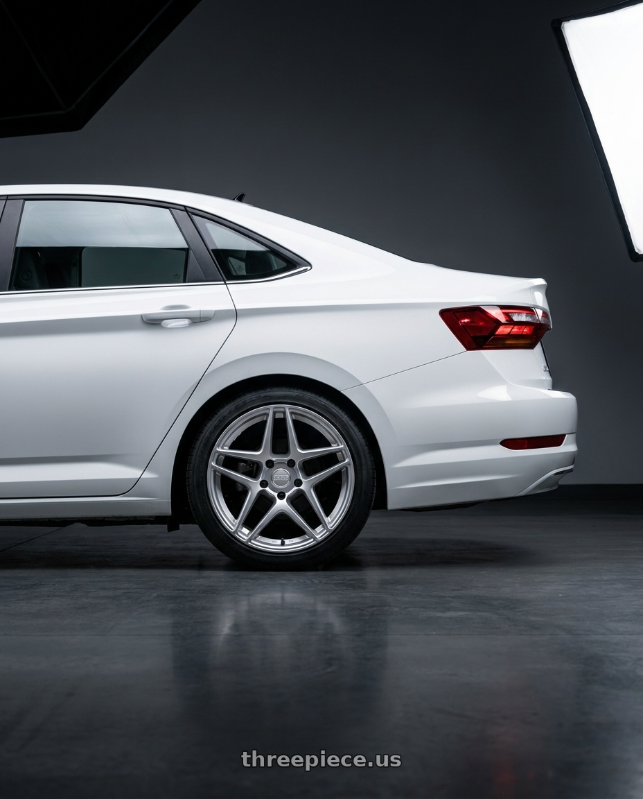 2026 vw jetta with Kansei K15H Astro 5X112 19x8.5 35 Hyper Silver wheels rear three quarter view square tires