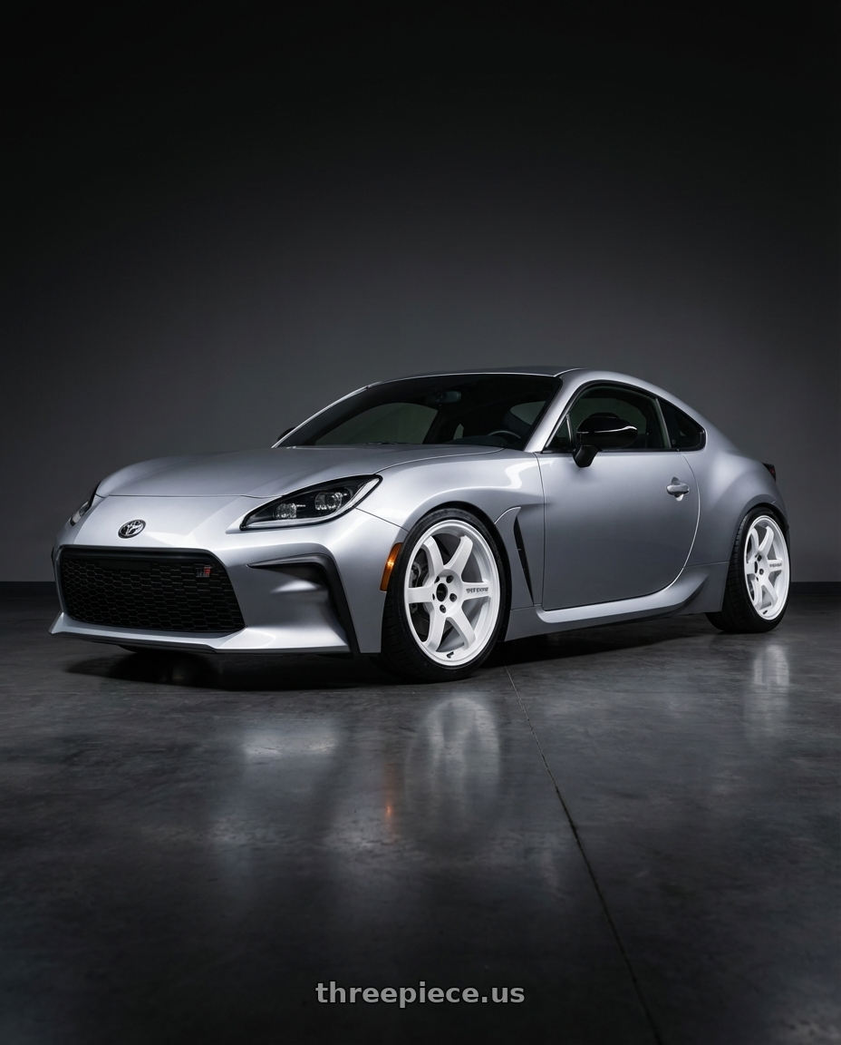 2023 TOYOTA GR86 with Volk Racing TE37 SAGA S-PLUS 5x120 18x9.5 +20 DASH WHITE wheels front three quarter view lowered stance