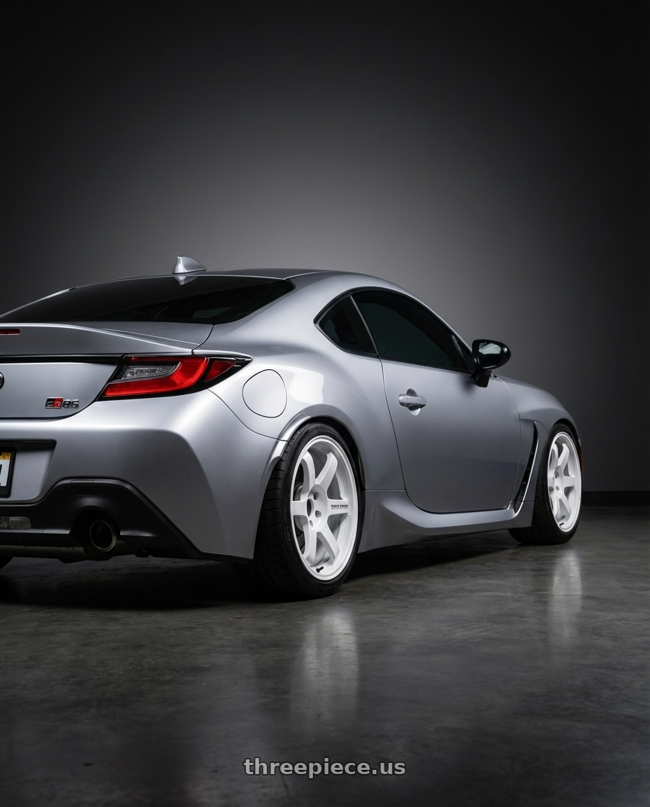 2023 TOYOTA GR86 with Volk Racing TE37 SAGA S-PLUS 5x120 18x9.5 +20 DASH WHITE wheels rear three quarter view square tires