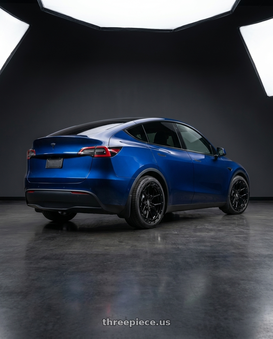 2023 Tesla Model Y with Rohana RFX19 5x112 19x8.5 +42 Gloss Black wheels rear three quarter view square tires