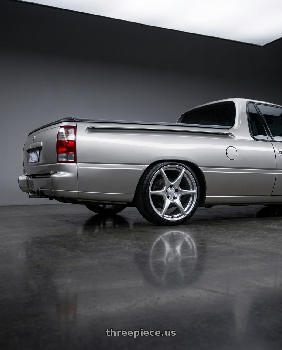 1999 vs commodore with Kansei K11S Tandem 5X120 19x9.5 22 Hyper Silver wheels rear three quarter view slight stretch tires