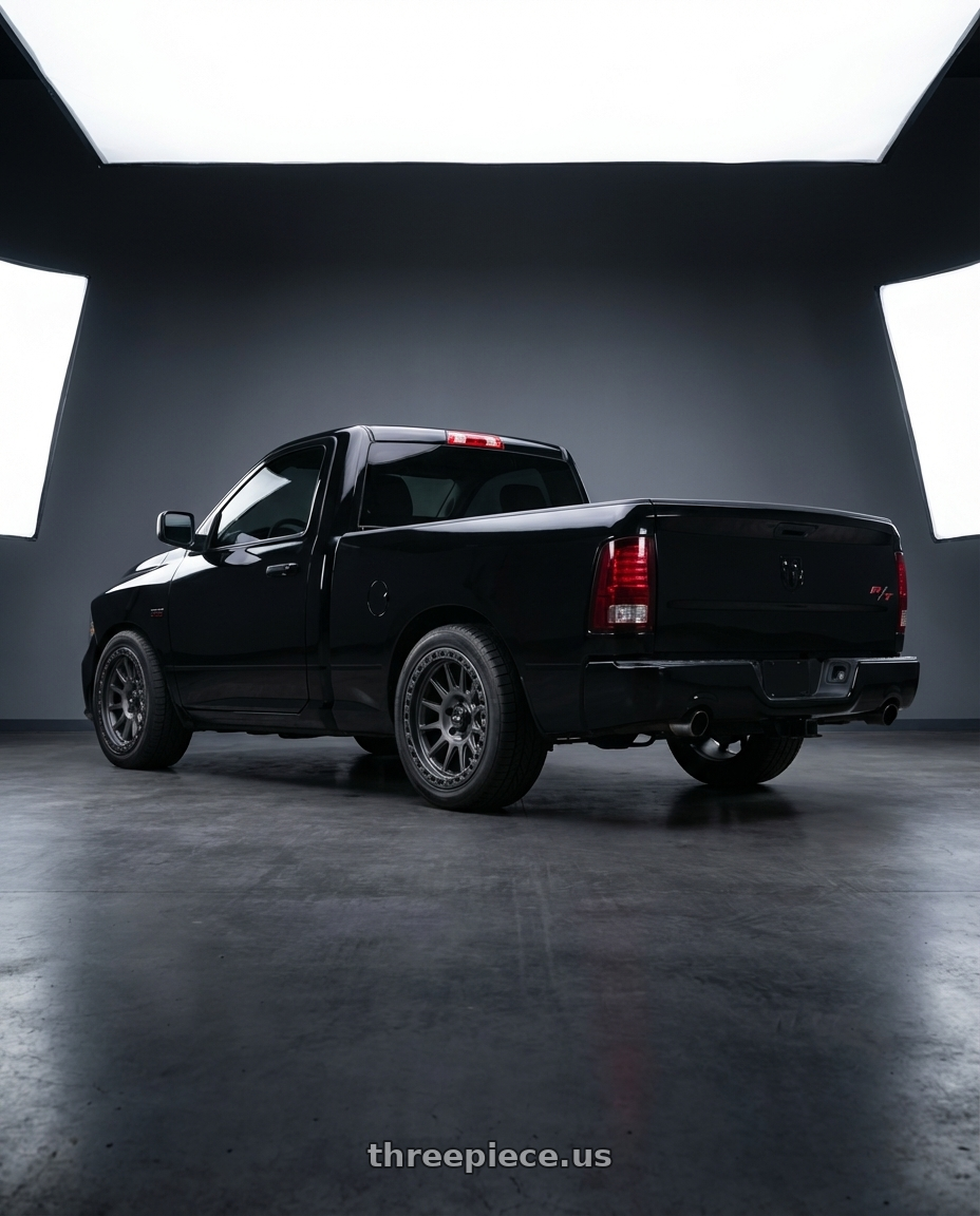 2017 ram 1500 with MVX OFFROAD VX12 5X127 18x9 +0 Matte Graphite wheels rear three quarter view square tires