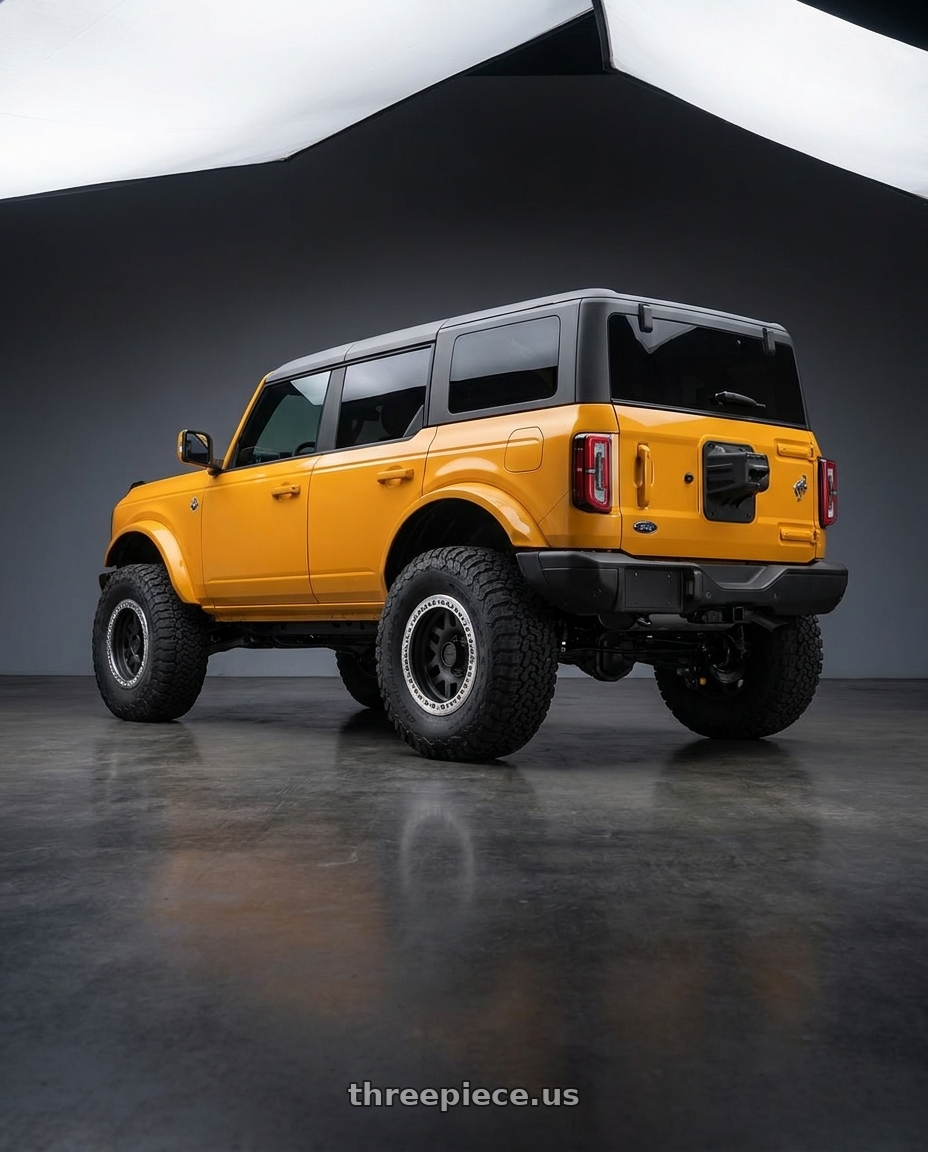 2024 Ford Bronco with KMC KM229 MACHETE CRAWL BEADLOCK 6X139.7 17X9 -38 SATIN BLACK MACHINED BEAD RING wheels rear three quarter view meaty tires