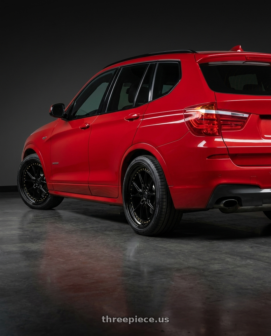 2017 x3 Msport with Aodhan DS08 5X120 19x8.5+35 Gloss Black W /Gold Rivets wheels rear three quarter view slight stretch tires