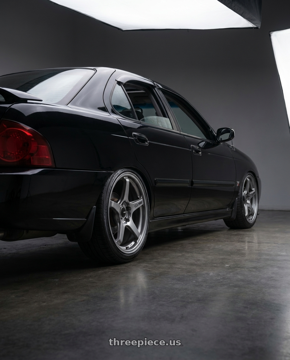 2002 nissan sentra with Enkei TS-5 5x114.3 17x8+40 Storm Grey wheels rear three quarter view slight stretch tires