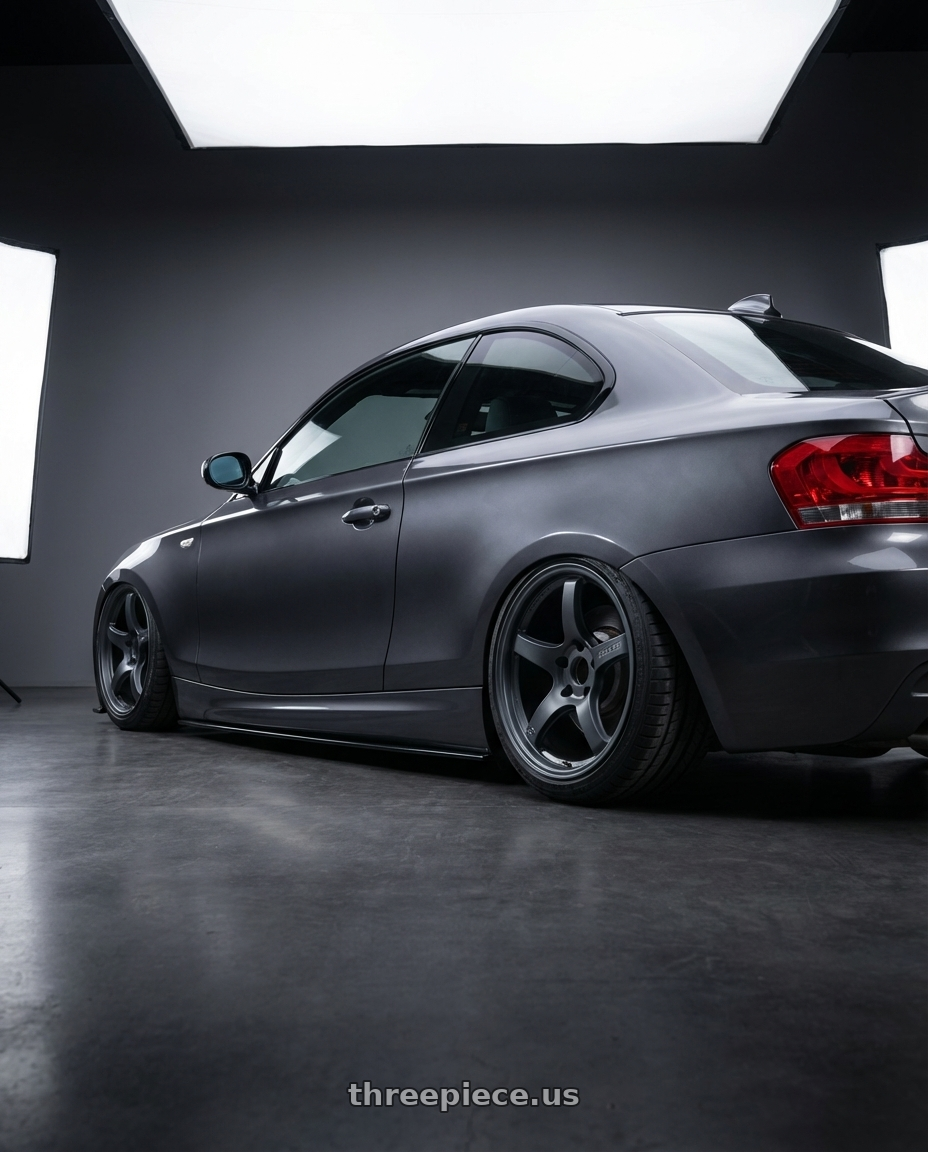 2012 BMW 1 Series E82 with Gram Lights 57CR 5x120 19x8.5+35 Gunblue II wheels rear three quarter view slight stretch tires