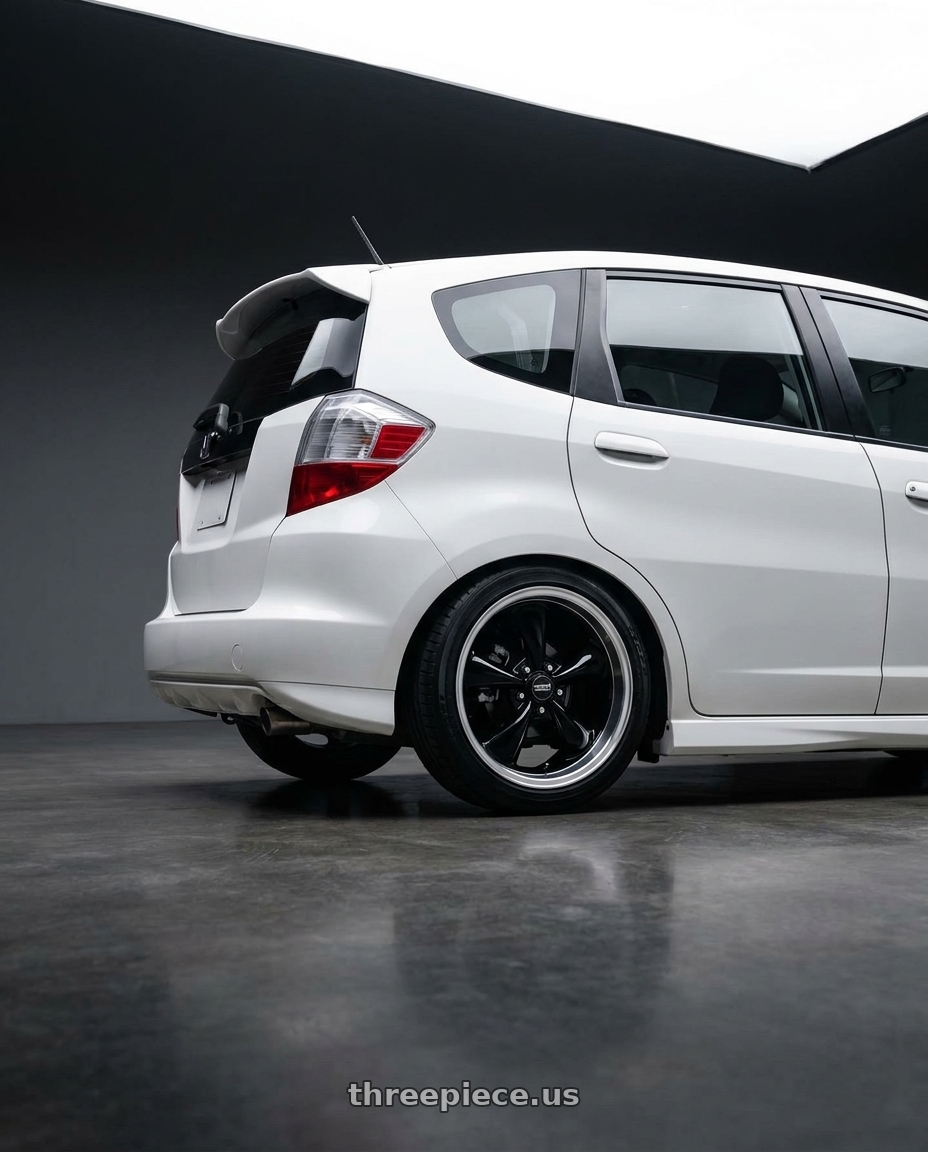 2010 Honda Fit with American Racing AR105 TORQ THRUST M 5X127 18X8 0 GLOSS BLACK W/ MACHINED LIP wheels rear three quarter view square tires