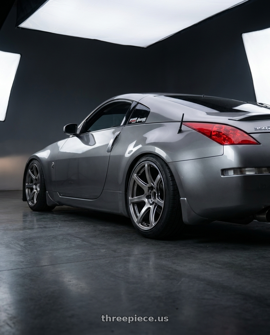 2007 Nissan 350z with Work Emotion T7r 5x100 18x10.5 +12 Gt Silver wheels rear three quarter view slight stretch tires