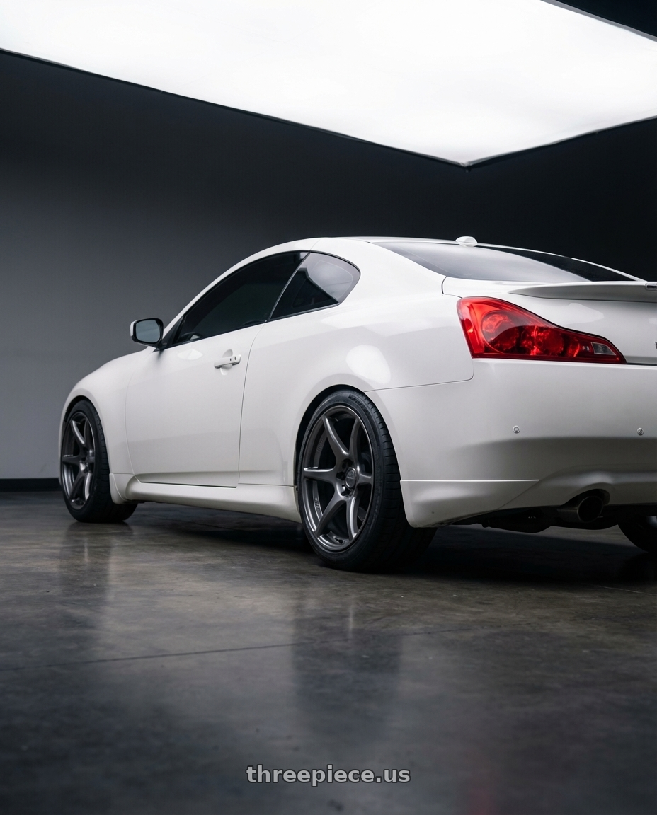 2014 Infiniti G37 Coupe with Kansei K11G Tandem 5x114.3 19x9.5 22 Gunmetal wheels rear three quarter view square tires