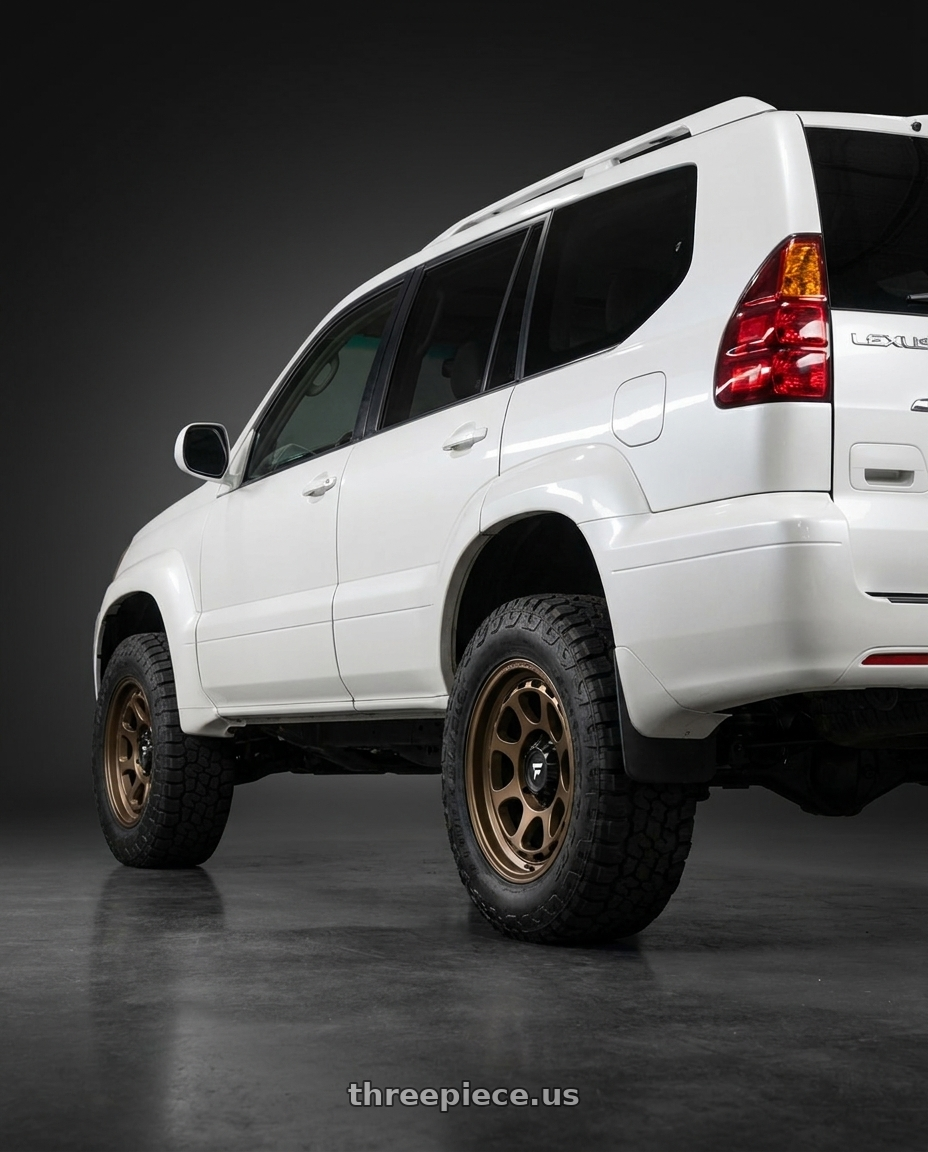 2007 lexus GX470 with Fittipaldi Offroad FT103Z 6x139.7 17x8.5 +0 Satin Bronze wheels rear three quarter view square tires