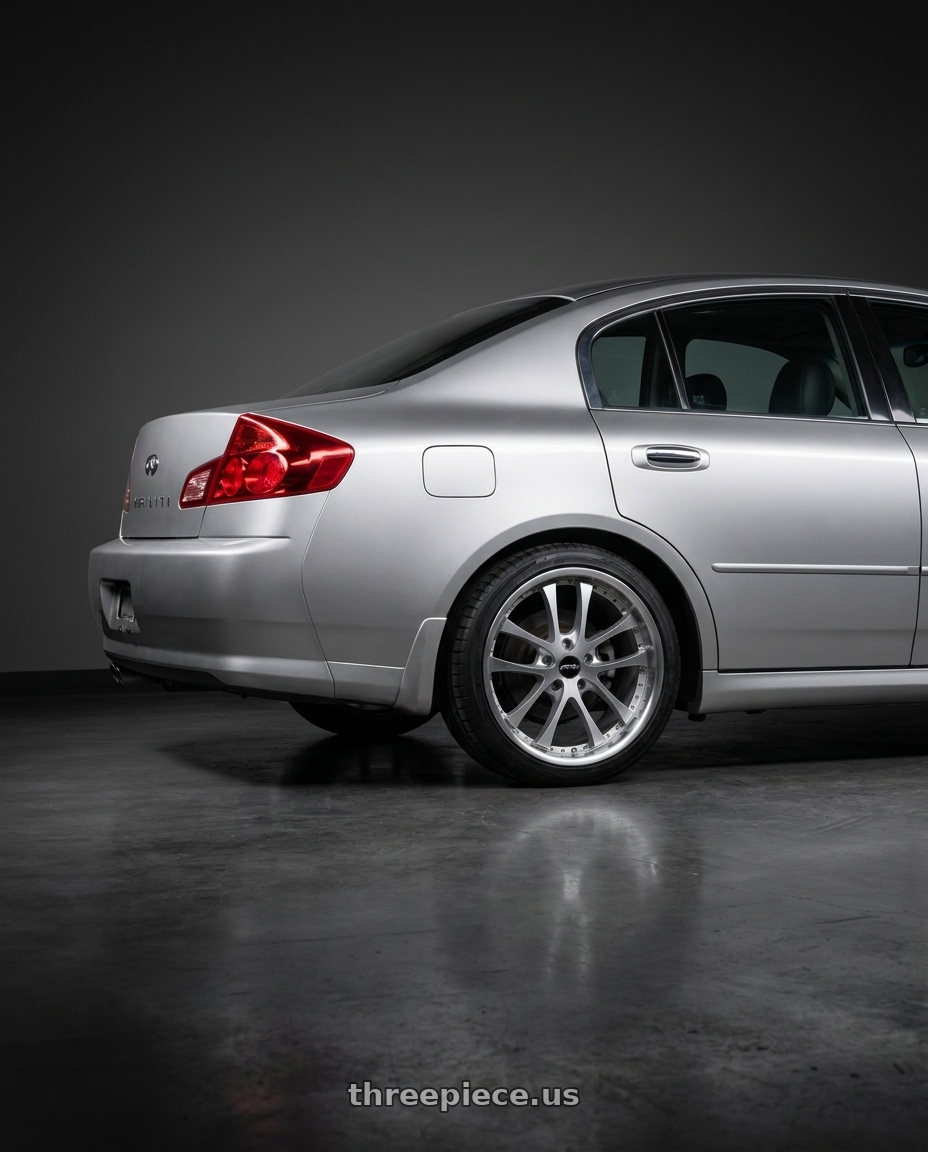 2004 Infiniti g35 sedan base model  with ARC AR5 5x114.3 18x9.5  +30 Silver Machine Face Lip Chrome Rivet wheels rear three quarter view square tires