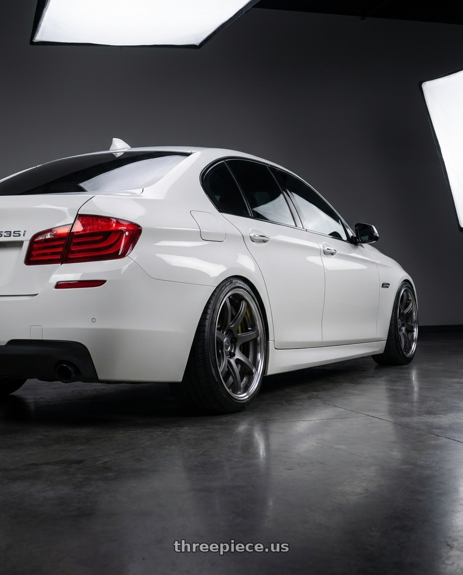2016 bmw 535i with Work Emotion T7R 2P wheels rear three quarter view slight stretch tires