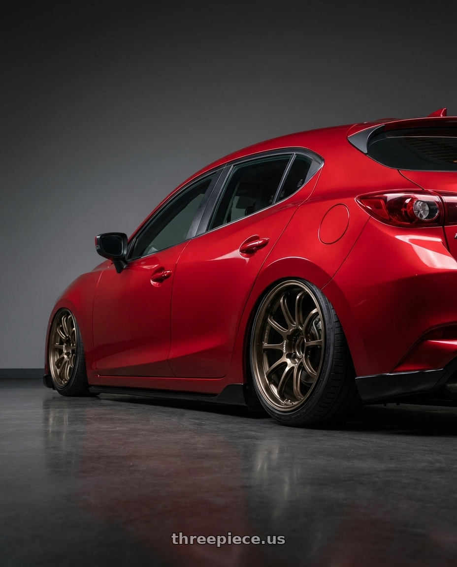 2018 Mazda 3 with Advan Racing RS-DF Progressive 5x120 18x8+45 Dark Bronze Metallic wheels rear three quarter view slight stretch tires