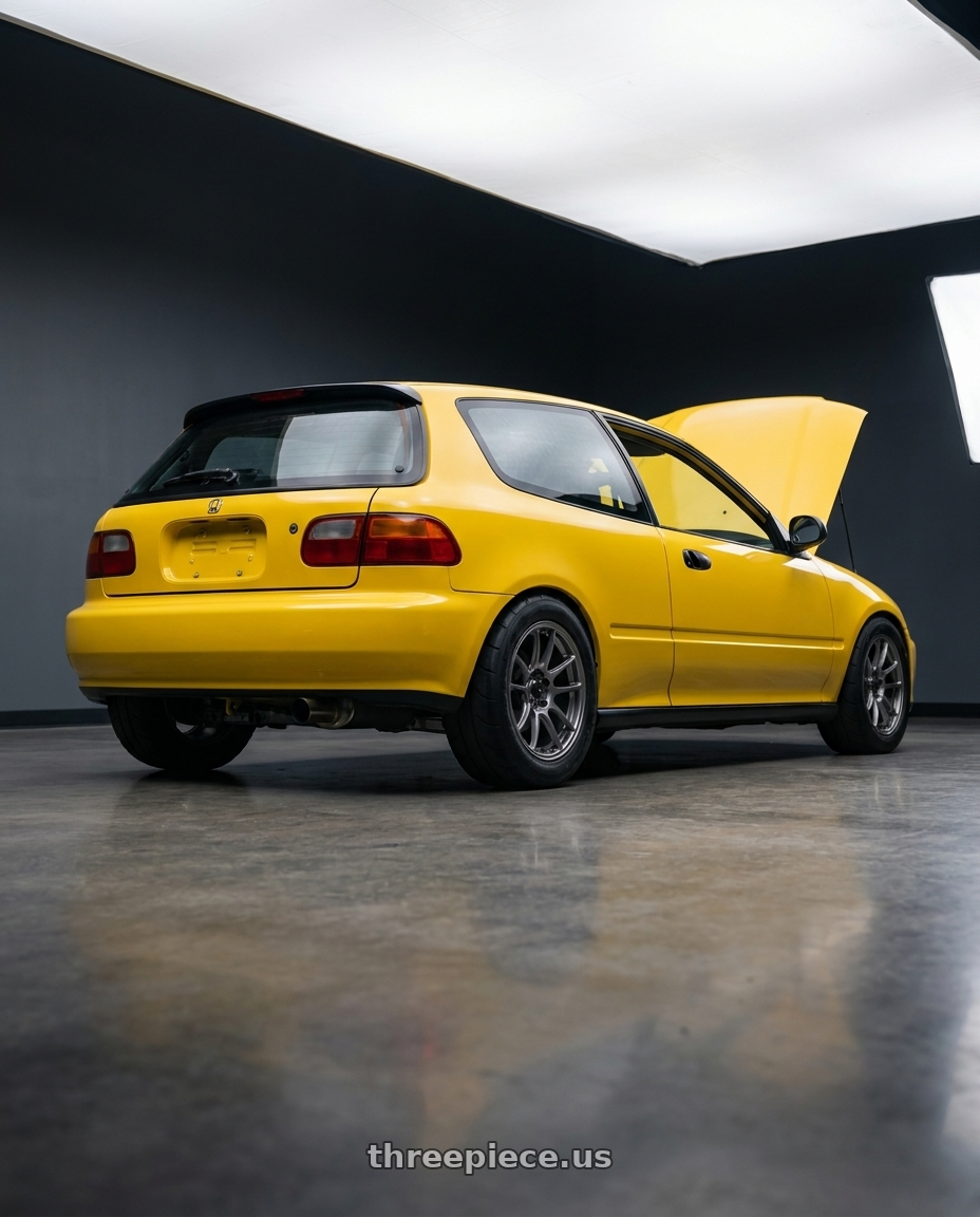 1994 Honda Civic hatchback with Konig Heliogram 4X100 15x8+36 Titanium Metallic Knurled Bead Flow Formed wheels rear three quarter view meaty tires