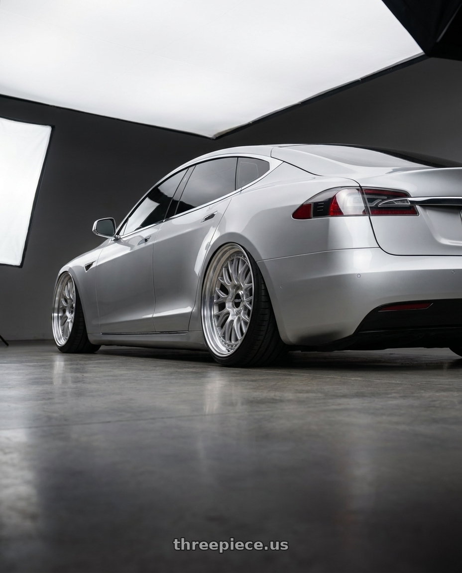 2018 tesla model s with Rotiform 1PC R155 LSR 5X112 19X8.5 +45 GLOSS SILVER MACHINED wheels rear three quarter view extreme stretch tires