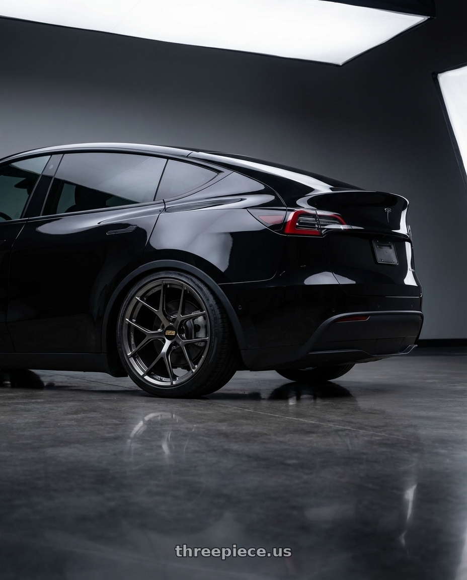 2026 Tesla Model Y Diamond Black Metallic with BBS FI-R 5x112 20x11.5+40 Diamond Black wheels rear three quarter view slight stretch tires