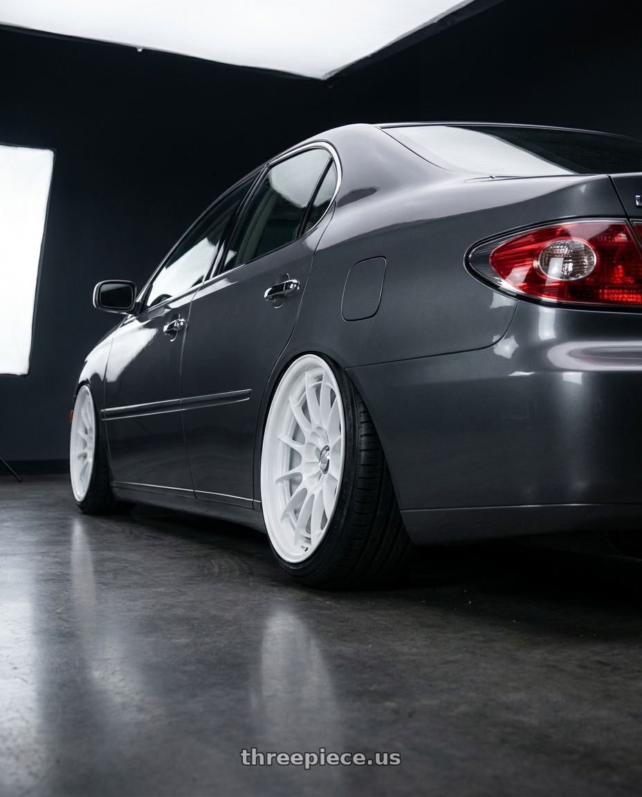 2003 Lexus ES300 with Enkei NT03+M 5x114.3 18x9.5+40 Vanquish White wheels rear three quarter view slight stretch tires