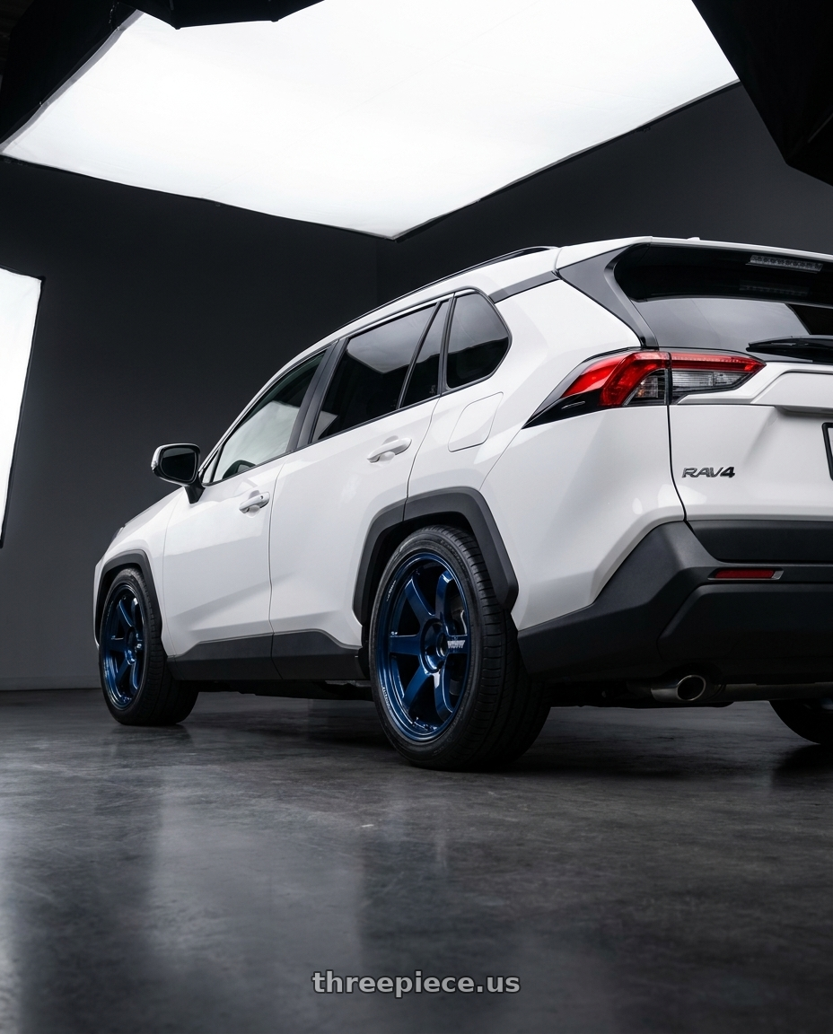 2025 Toyota rav4 sled premium with Volk Racing TE37 ULTRA M-SPEC 5x114.3 19x9.5+25 Mag Blue wheels rear three quarter view square tires