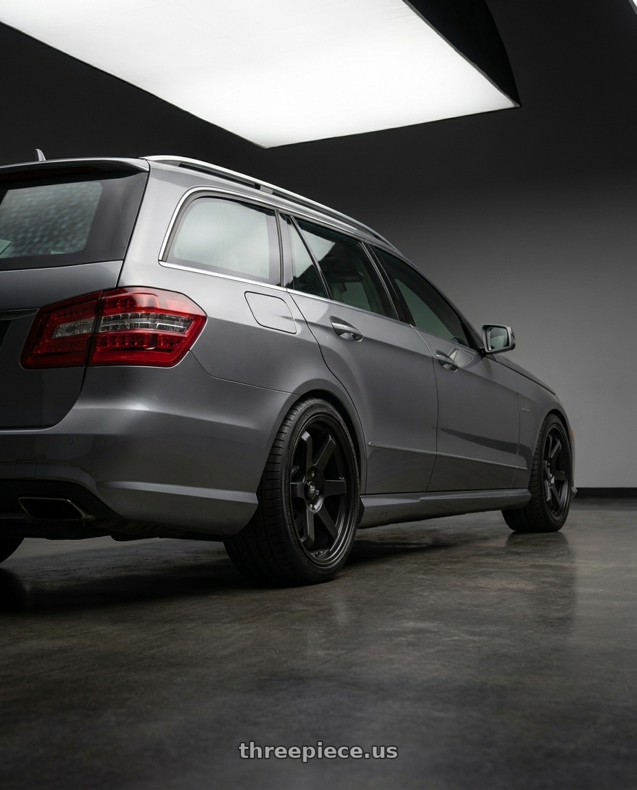 2010 Benz S212 with MST Wheels MT01 5x100 18x9.5 +35 Matte Black wheels rear three quarter view square tires