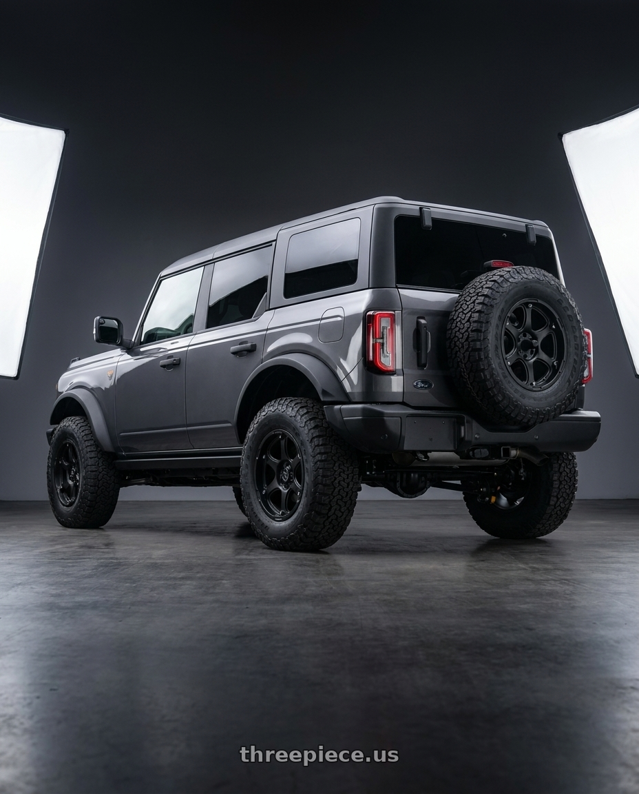 2023 Ford Bronco Badlands with Black Rhino GLAMIS 6X139.7 17X9 +12 MATTE BLACK wheels rear three quarter view square tires