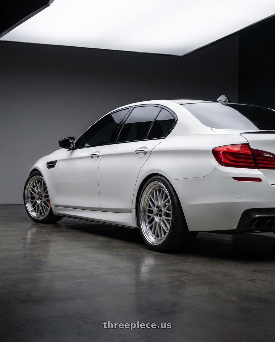 2014 BMW F18 M5 with BBS LM 5x120 20x10.0+20 Diamond Silver wheels rear three quarter view square tires