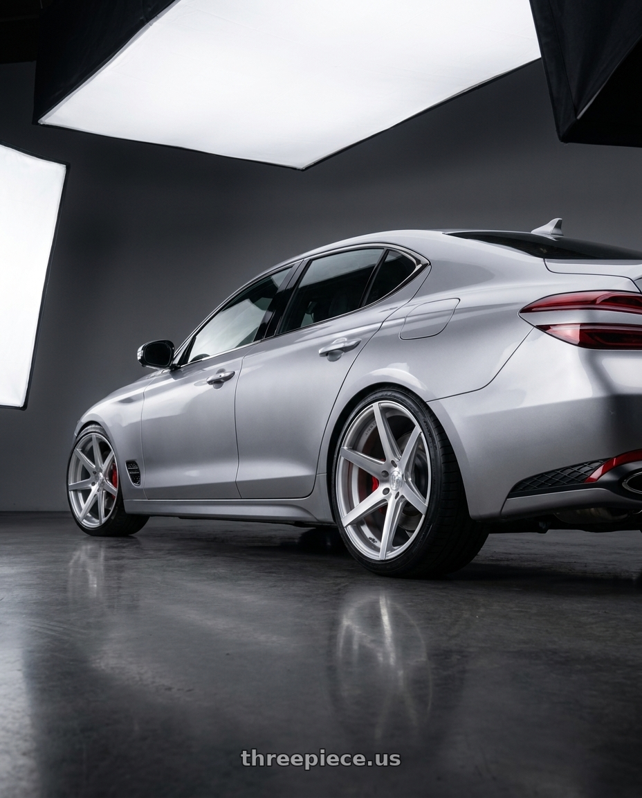 2024 genesis g70 with Rohana RC7 5x112 20x9+25 Machine Silver wheels rear three quarter view slight stretch tires