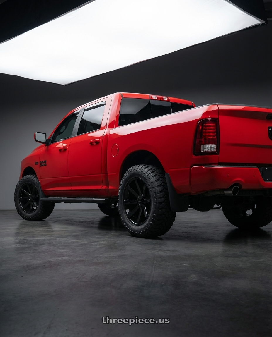 2016 Dodge Ram with KMC KM651 SLIDE BLANK 20X8.5 +10 GLOSS BLACK wheels rear three quarter view meaty tires