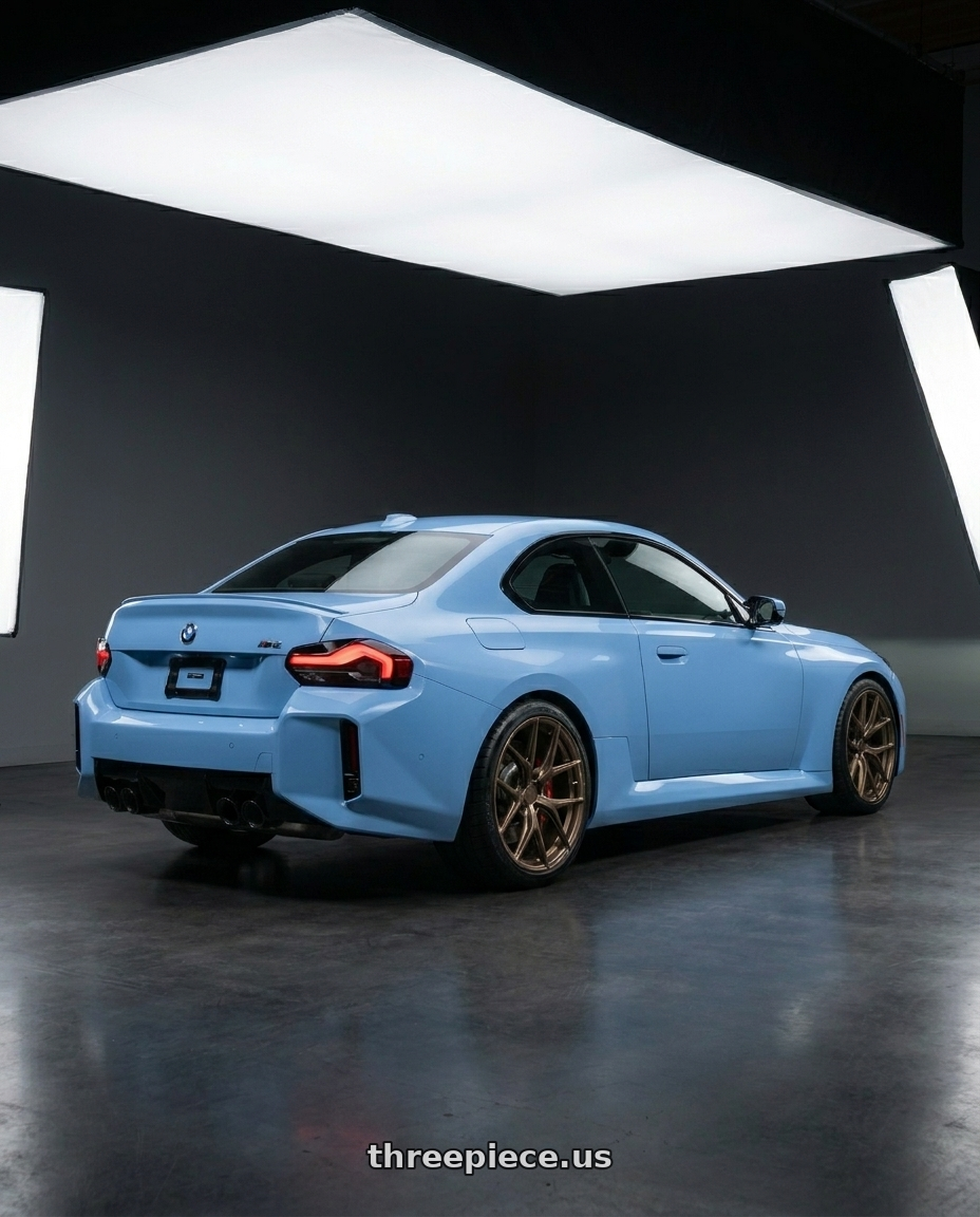 2026 BMW M2 with VOSSEN HFX-4 6X135 17x9 +0 SATIN BRONZE wheels rear three quarter view square tires