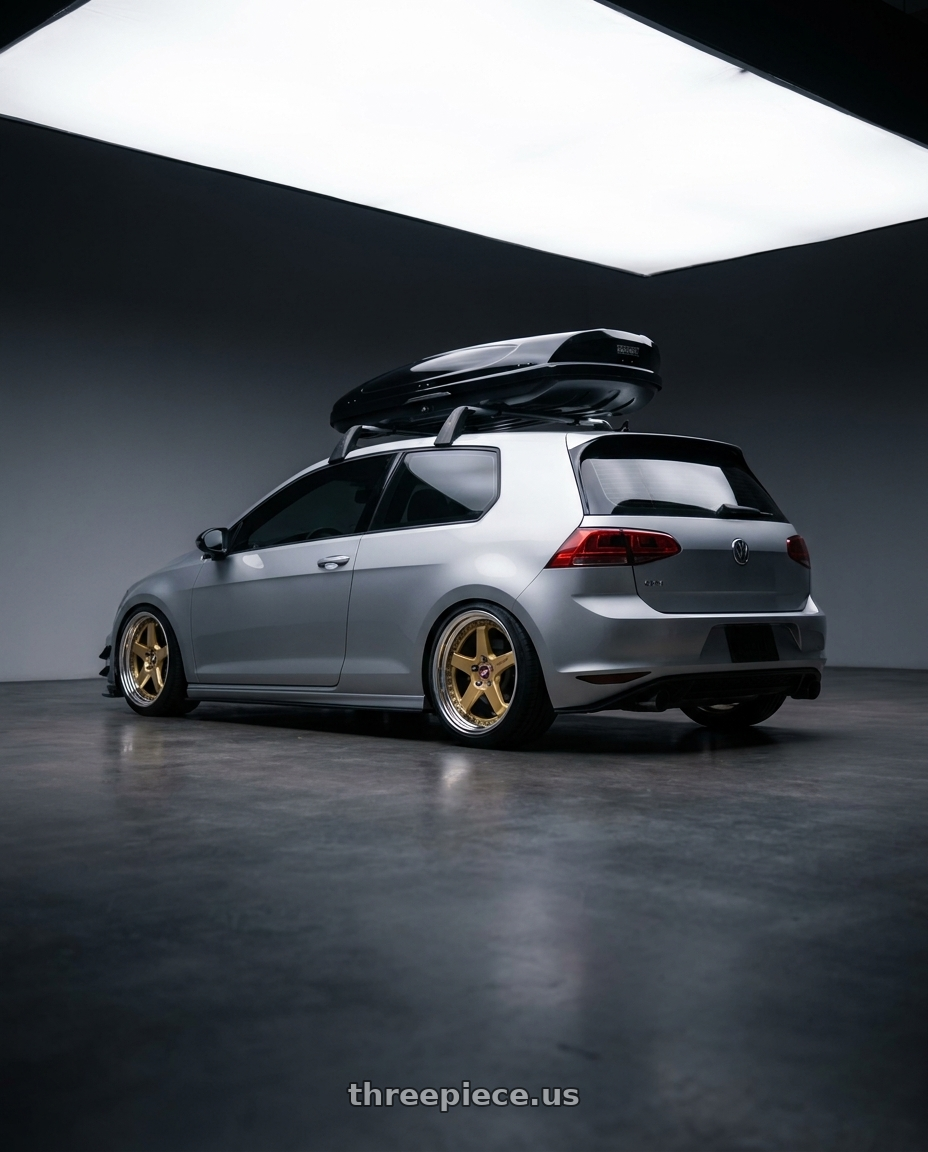 2015 VW GTI with Work Zistance W5s 5x112 19x9+35 w disk Gold wheels rear three quarter view square tires