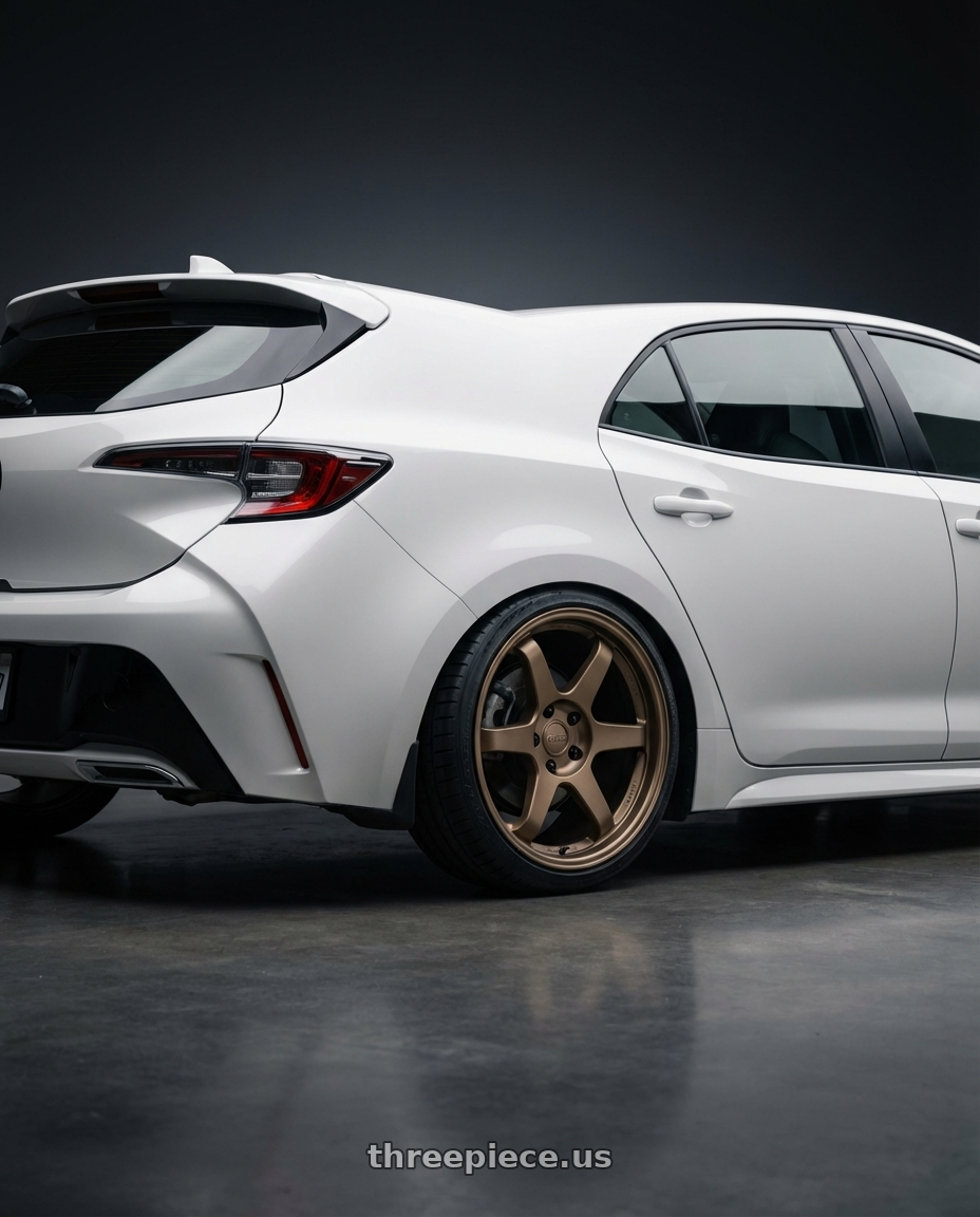 2023 Toyota Corolla Hatchback with Kansei K11B Tandem 5x114.3 18x9 12 Bronze wheels rear three quarter view square tires