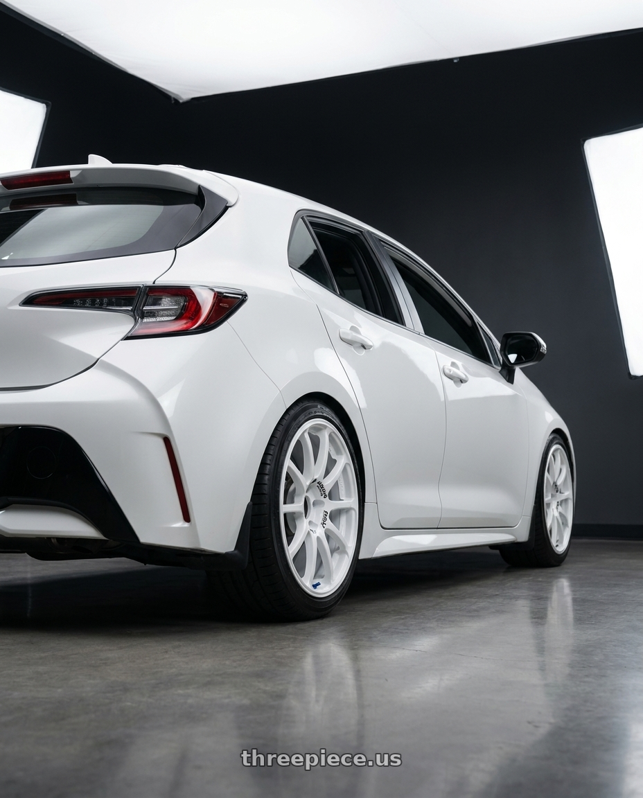 2023 Toyota Corolla Hatchback with Advan RCIII 5x114.3 18x8.5+38 White wheels rear three quarter view square tires