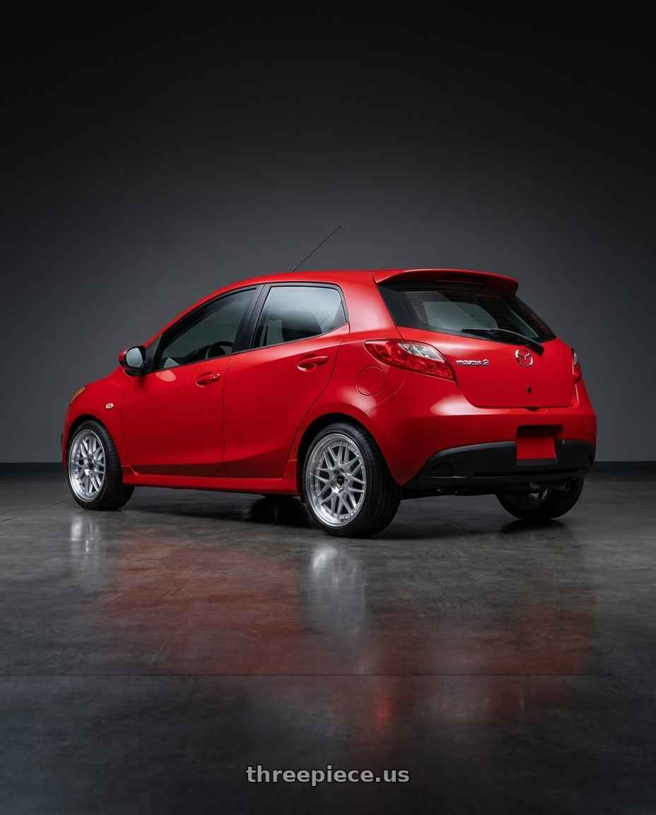 2012 mazda 2 with Vors VR7 4x100/4x114.3 15x7  +35 Silver Machine Face Lip Chrome Rivet wheels rear three quarter view square tires