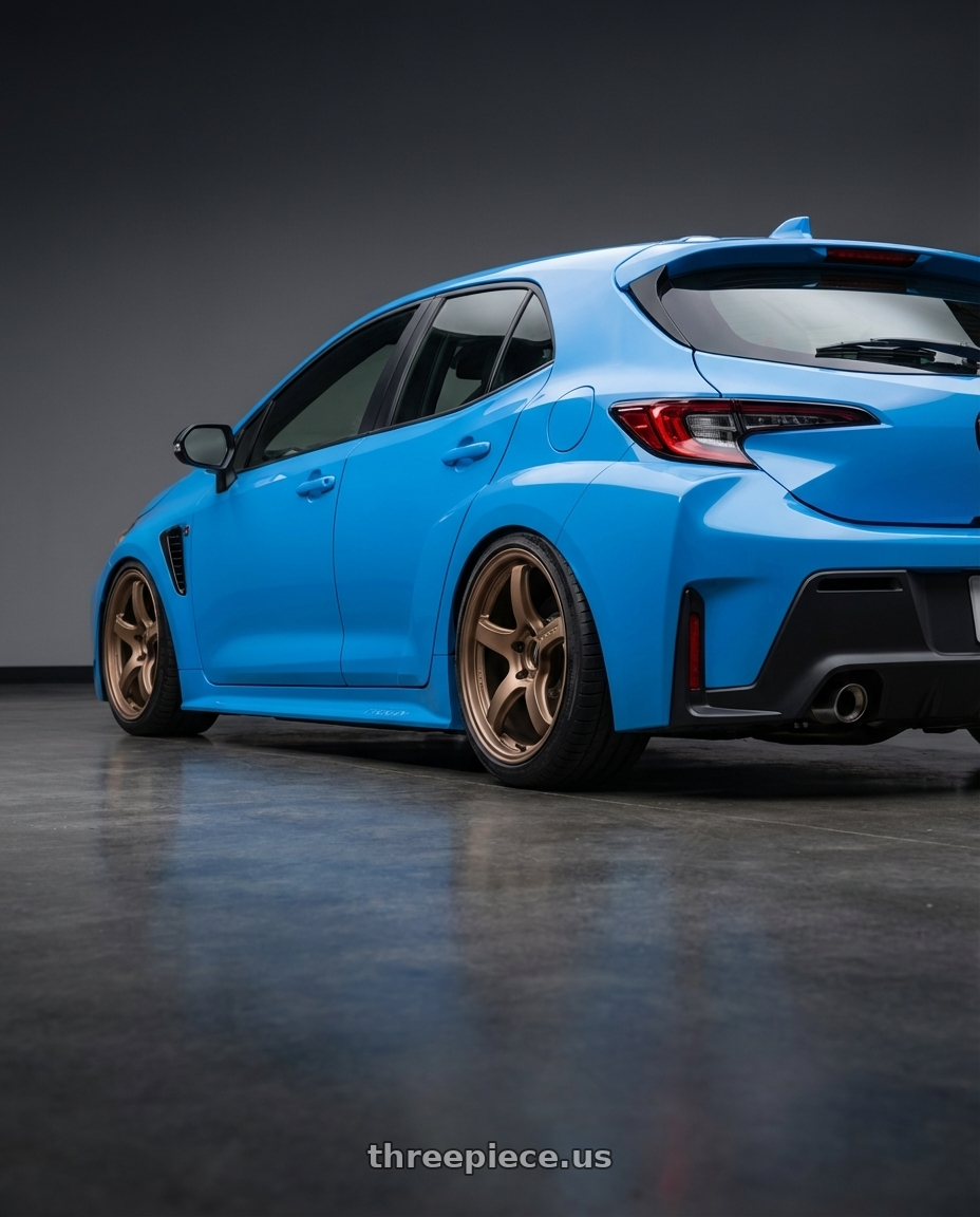 2024 Toyota GR Corolla with Gram Lights 57CR 5x114.3 18x9.5+38 Bronze II wheels rear three quarter view slight stretch tires