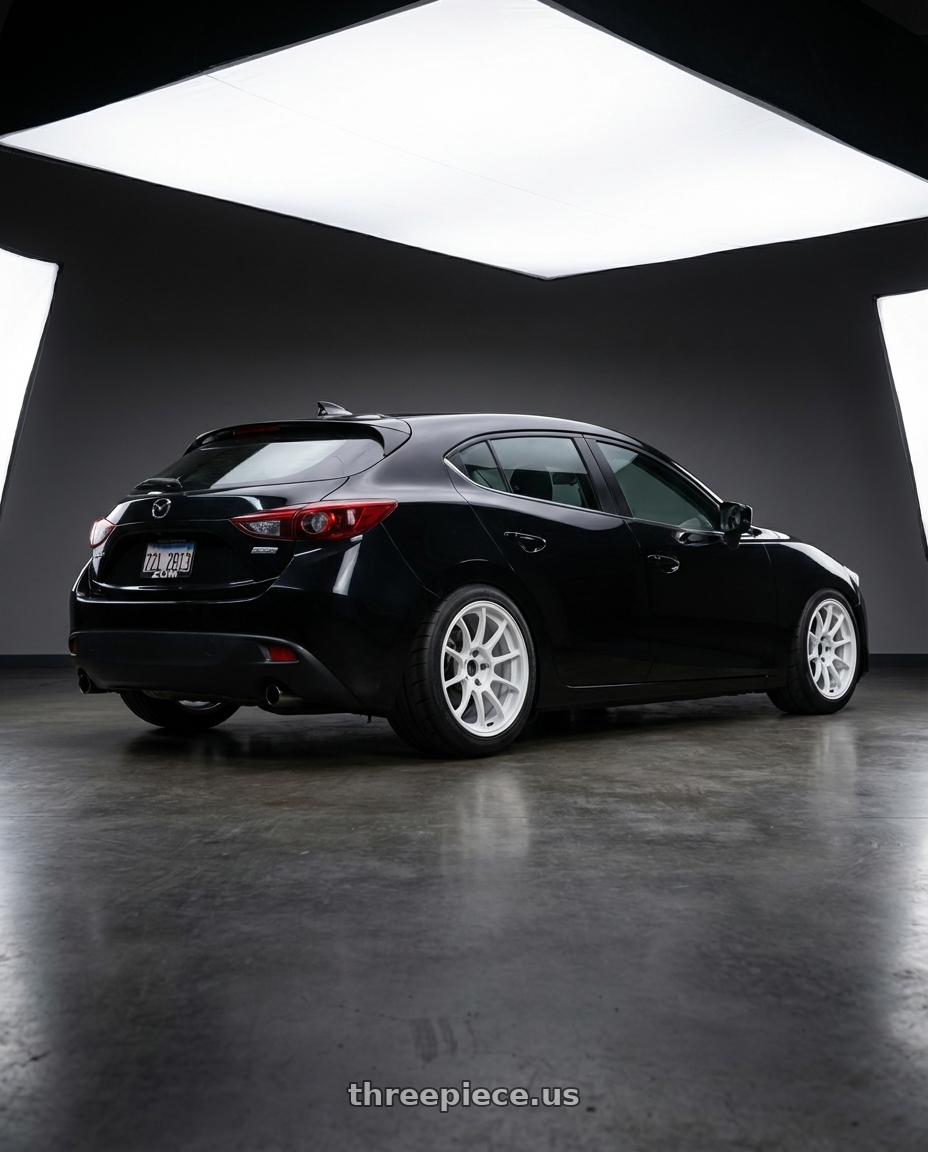 2016 Mazda 3 hatchback with Volk Racing ZE40 5x114.3 17x8 +38 DASH WHITE wheels rear three quarter view meaty tires