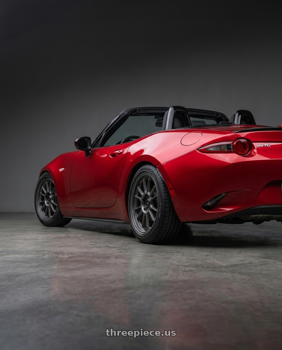 2016 Mazda Miata with Konig Hypergram 4x100 16x8+38 Matte Grey wheels rear three quarter view square tires