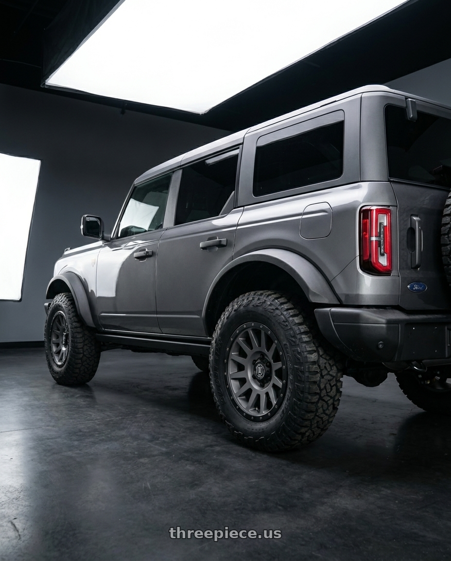 2023 Ford Bronco with Icon Alloys COMPRESSION 6x139.7 17X8.5+25 TITANIUM wheels rear three quarter view square tires